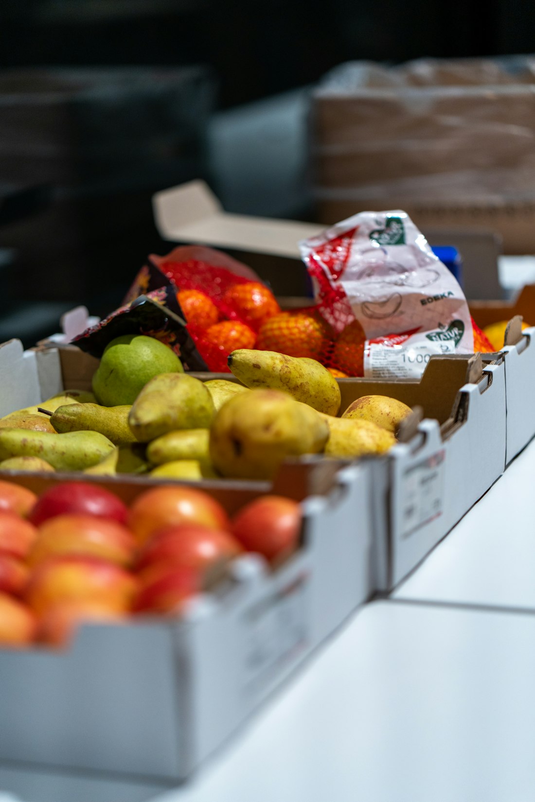 Crates of fresh pears and apples